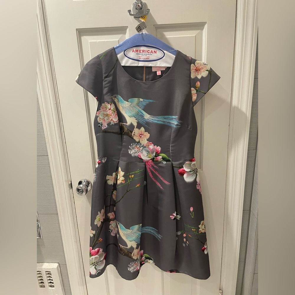 Ted baker dress grey with birds on it. A UK size 5 is an US size 10.